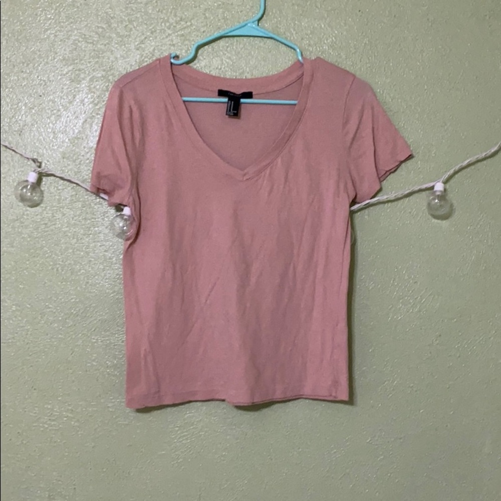 Place pink V-neck